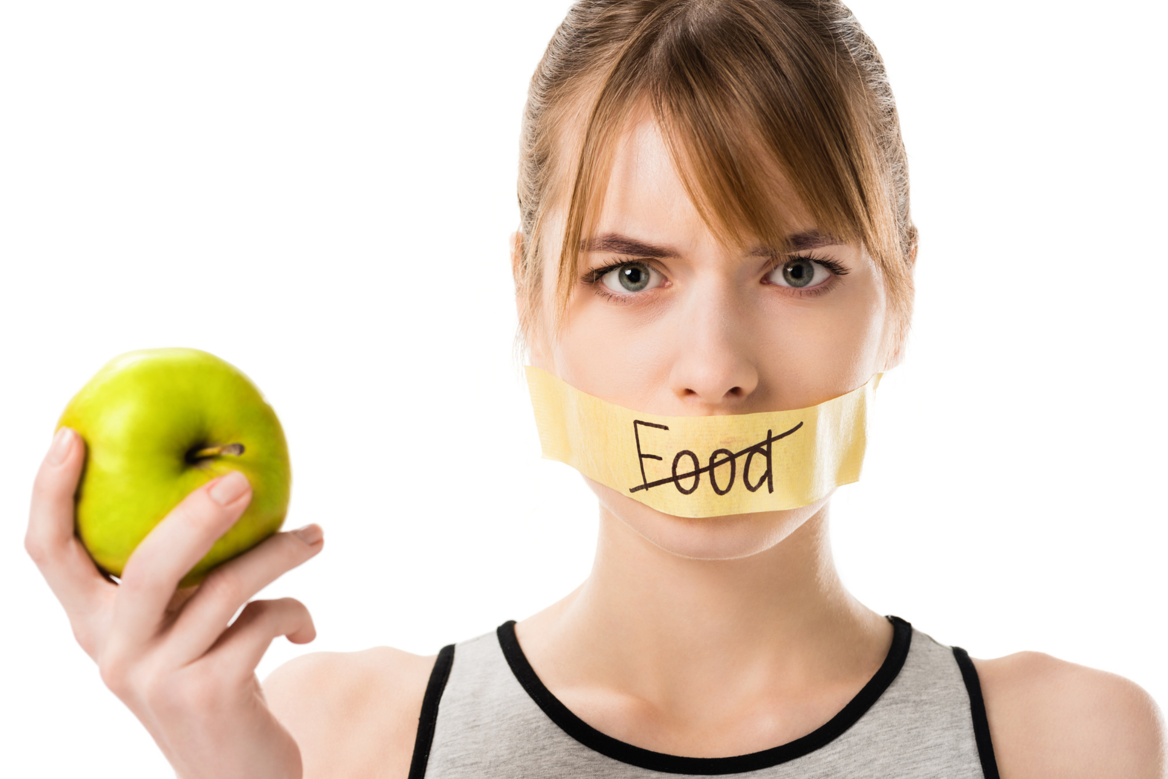 woman holding apple saying no to dieting